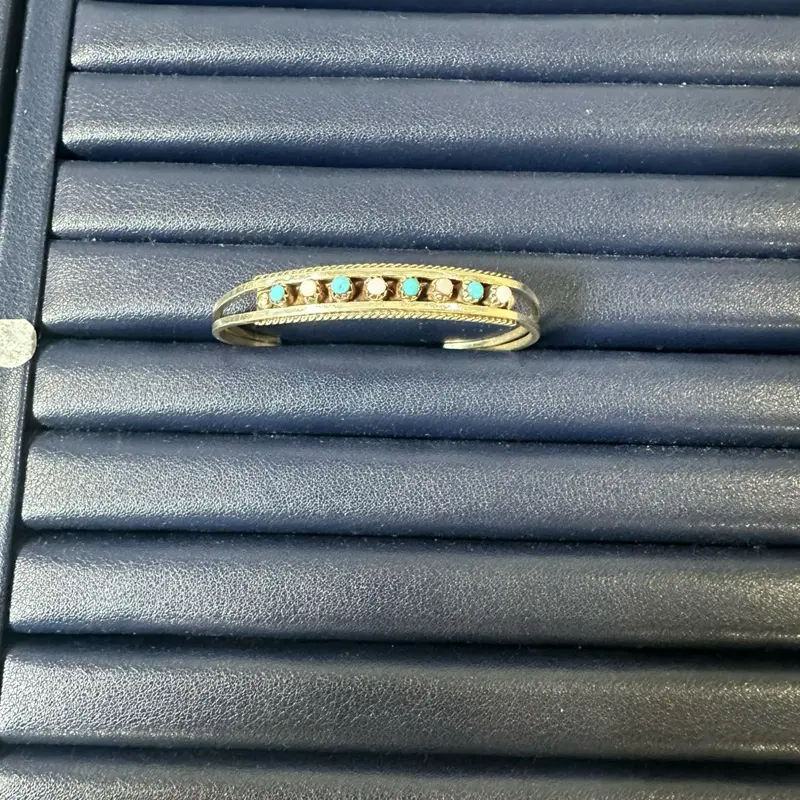 Pink conch and turquoise cuff Zuni