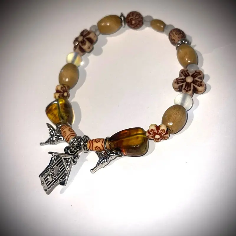 Glass and Stone Beaded Bracelet with Silver Metal Hummingbird and Birdhouse Charms Featuring Natural Beads and Unique Designs