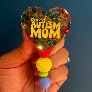 Candidly Heart Badge Reel - Proud Autism Mom, 1.5” Diameter, Retractable, Metal Alligator Clip, 360 Degree Rotation, Hand-Glazed Design