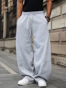 Men’s streetwear baggy sweatpants, Y2K style elastic waist drawstring wide-leg pants, casual loose-fit track pants with pockets, cool trendy joggers for everyday and street style