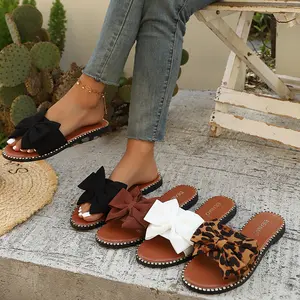Sweet bow flip-flops for women—summer open-toe, versatile casual slides for outdoor wear, available in multiple colors.