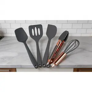 5-piece mini silicone kitchen utensil set in rose gold and pink. Includes whisk, spatula, tongs, spoon and slotted spatula, perfect for kids baking and pretend play.  SURE