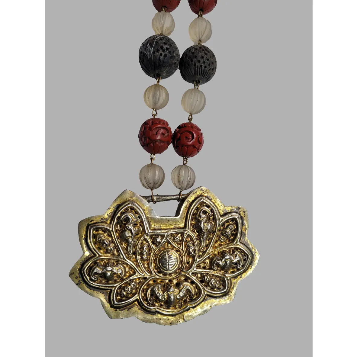 Vintage Cinnabar Necklace with Intricate Pendant and Mixed Beads Chinese Artistry Hand-Carved Floral Scroll Design Gold-Toned Metal Lotus Pattern