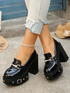A pair of Women's Patent Leather Platform Loafers, Chunky Block Heel, Slip-On Style, Pearl & Metal Buckle Detail, Studded Lug Sole, Elevated Height, Comfortable Footwear for School, Office, Casual Outings, Versatile Retro Shoes
