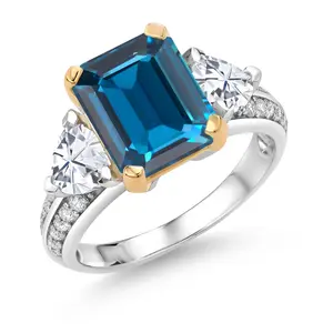 Gem Stone King 5.13 Cttw London Blue Topaz and White Moissanite 3 Stone Engagement Ring For Women | 925 Sterling Silver and 10k Yellow Gold | Emerald Cut 10X8MM