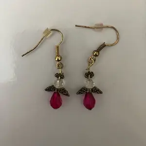 Tiny pink angel earrings