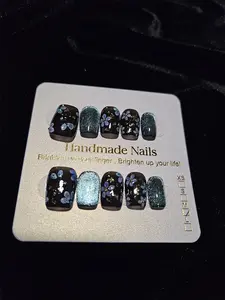 Handmade Nails Glittery Teal with Shimmering Finish Black Base Decorated with Blue Floral Patterns & Silver Glitter Accents