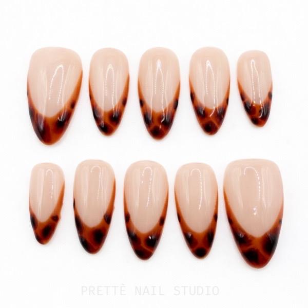 Prettè Nail Studio Amber Muse Press On Nails Medium Almond Nude Tortoise French Tips for Stylish Manicures