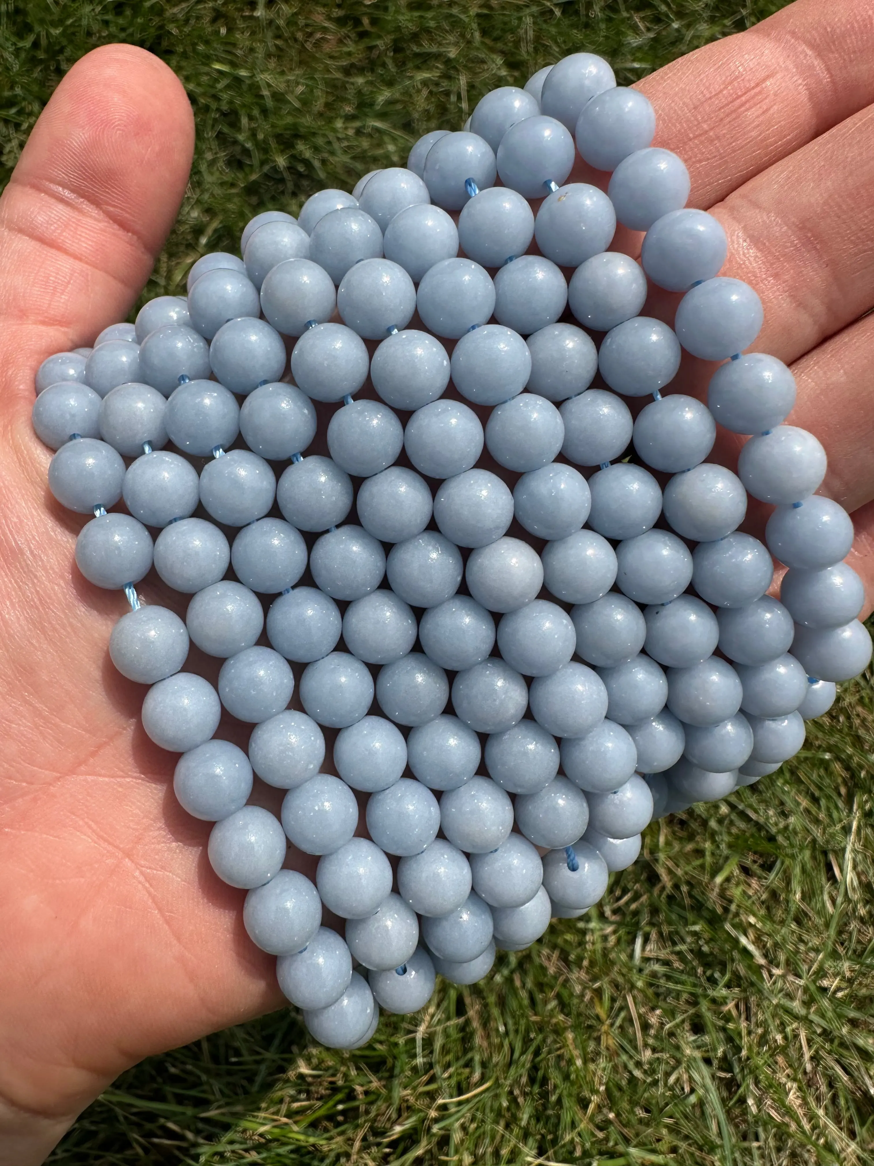 New Moon Beginnings Angelite Bead Strand - Grade AA, Blue Color, Round Beads, Handheld, Quality Assurance Not Specified