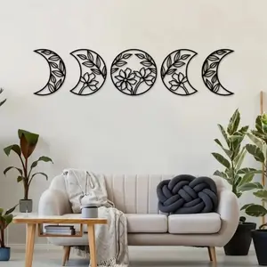 A set of 5 captivating metal moon phase wall hangings. Infused with floral leaf elements in Nordic style, they're ideal wall ornaments for a unique decor touch. Decorative hanging ornaments