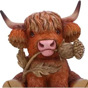 A cute Scottish highland cow resin statue with flowers - a lifelike red furry coat and green leaf embellishments. It is perfect for home decoration, indoor or outdoor use, unique gifts for couples, table decorations, decorative pieces, and a natural style