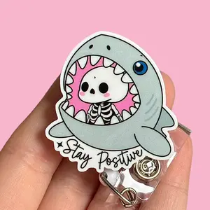 Glitter My Badge This stay positive shark nurse badge reel for nurse and hospital workers. Badge clip Badge pull - Retractable swivel clip with a 360 rotation. Great gift for coworker.