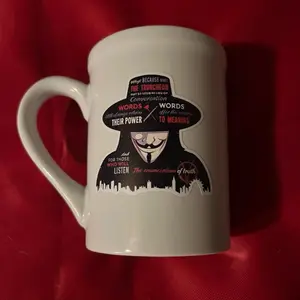 Coffee Cup with Iconic Guy Fawkes Design - Perfect for Fans of The Emancipation of Truth