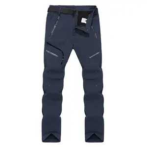 Men's fleece lined outdoor sports pants for autumn and winter. These are warm polyester long pants, featuring windproof and water repellent properties, suitable for hiking and skiing. The men's pants are equipped with zippered pockets.
