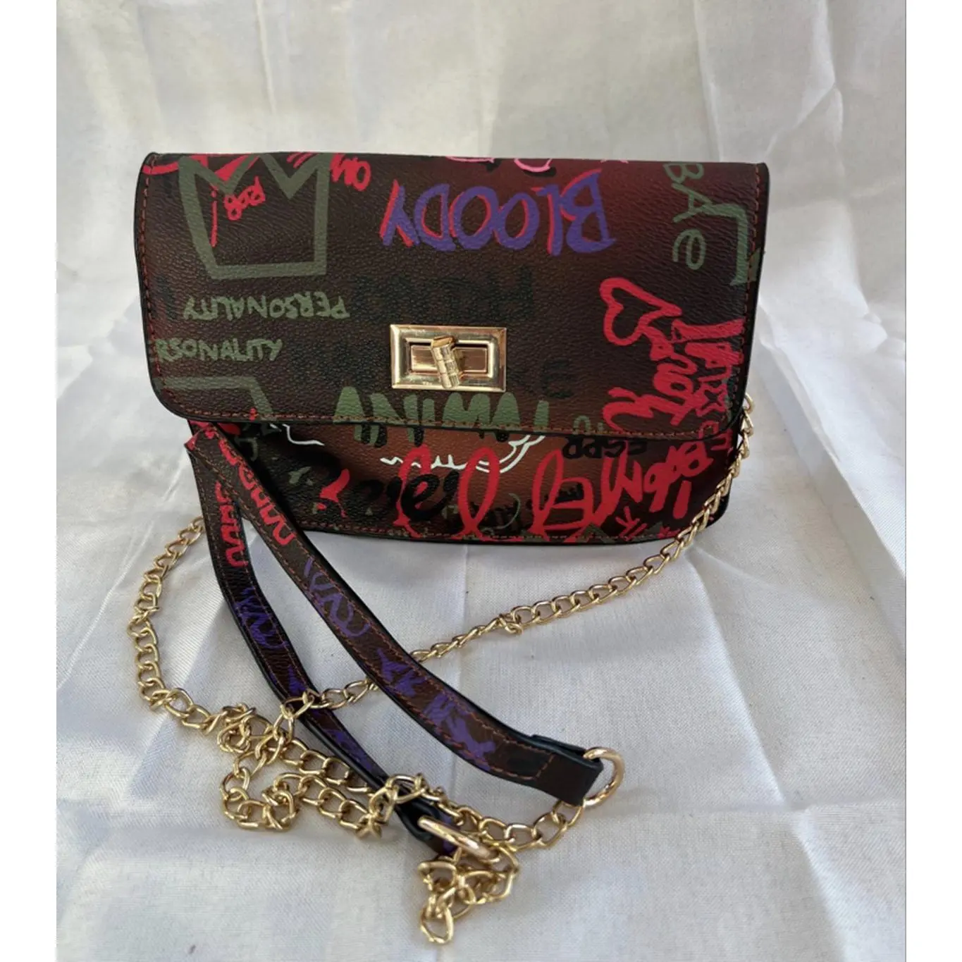 Graffiti Design Chain Strap Crossbody Bag with Gold Tone Hardware and Colorful Text