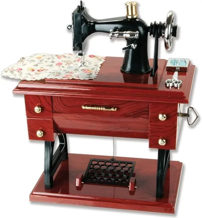 Vintage Mini Sewing Machine Music Box – Crank it and listen to a tiny melody. Retro plastic tabletop decor that doubles as a toy gift for kids. Brown finish, nostalgia included. Whimsical, charming, and screen‑free fun for little hands.
