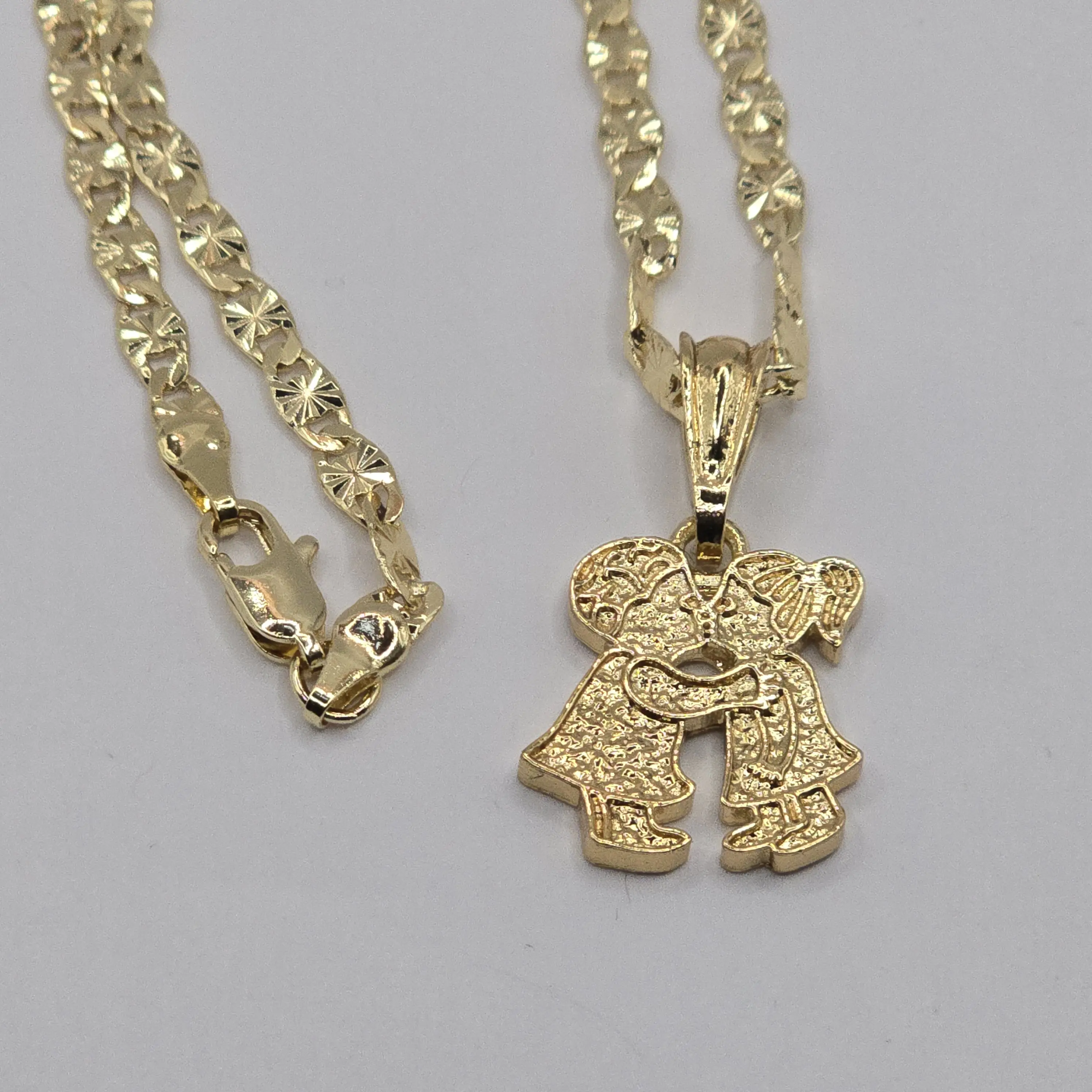 Couple with necklace gold-plated.
