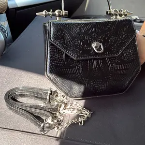 Women’s Unique Black Embossed Handbag with Silver Hardware and Unique Design Comes With Chain