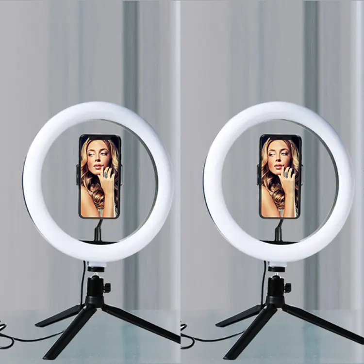 Ring Light (10inch) Desktop Tripod with Phone holder and  3 different types of LED Light. Fits a variety of iPhones from regular size to Pro Max. USB connection.