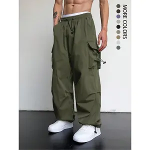 Men’s loose-fit army green cargo trousers with a drawstring waist and pockets—fashionable and comfortable wide-leg pants suitable for autumn workwear.