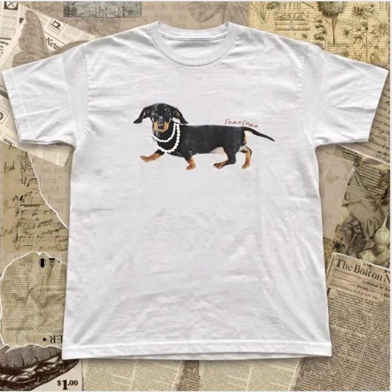 White t-shirt with black dachshund wearing a pearl necklace