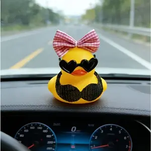 Sexy little yellow duck, wearing sunglasses and bow headdress, is an essential accessory for automobile interior, suitable for motorcycles and bicycles.