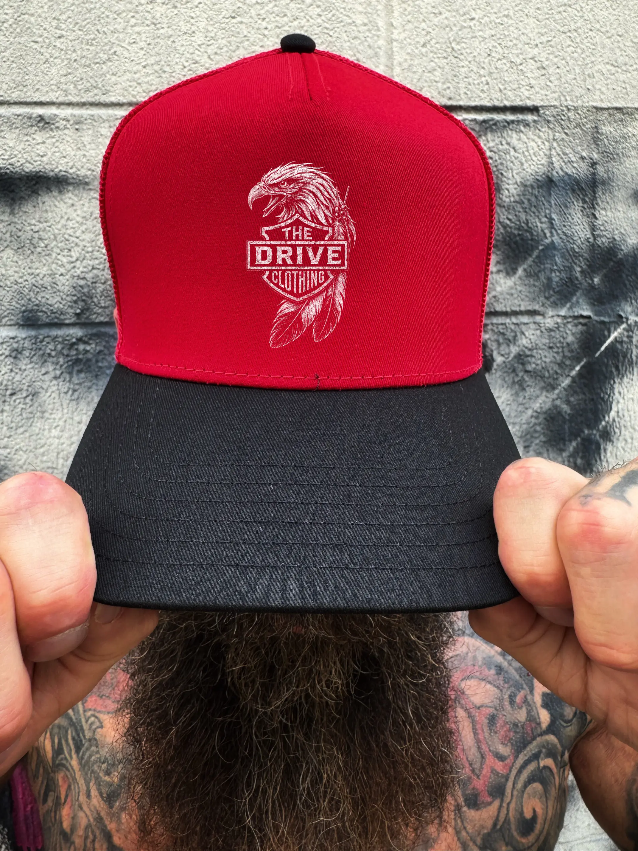 EAGLE FEATHER RED BLACK CURVED TRUCKER HAT