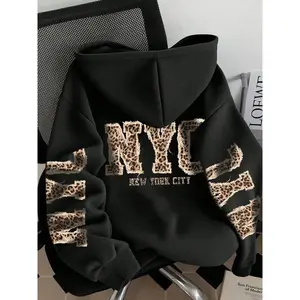 Unisex fashion black hoodie with New York City leopard print pattern, oversized comfortable pullover, trendy streetwear for teenagers and adults, perfect choice for autumn and winter casual wearRAIMENTRY