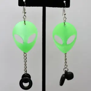 ALIEN PLUG BUDDIES made of resin with glow in the dark and UV reactive powder. The earring part is nickel free metal and have a chain with a silicone ring that can attach to most earplugs.
