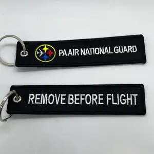 Black Remove Before Flight brand keychain