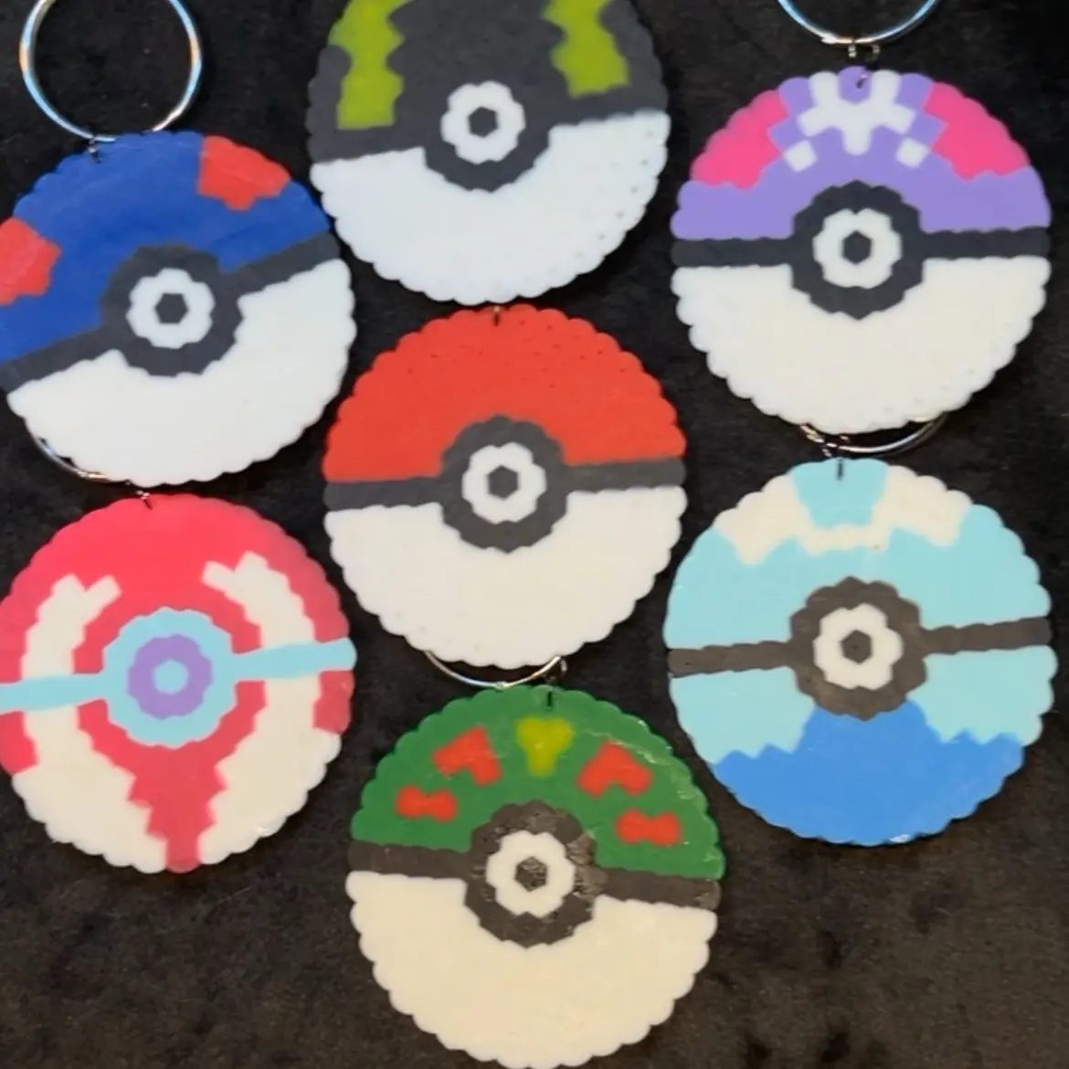Pokeball keychains a small variety of them! Ultra ball, great ball, master ball, dive ball,friend ball and heal ball Plastic