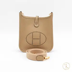 Pre-owned HERMÈS Taurillon Clemence Crossbody Bags Hermes Evelyne Mini 16 in Trench with gold hardware crossbody bag