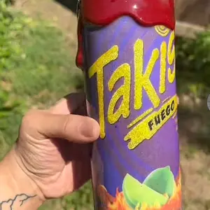 Takis 20oz Fuego Brand Product in Purple and Red Container as Shown