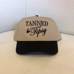 Tanned & Tipsy Embroidered Trucker Hat with Fast Shipping Beige and Black Design