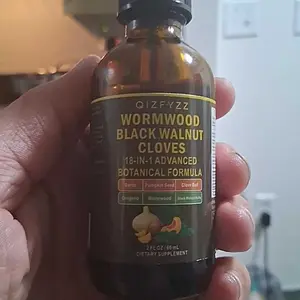 Qizfyzz 18-in-1 Black Walnut and Wormwood Detox Drops, each serving contains 6600 mg, helps with intestinal cleansing and digestive health. Ingredients include clove, garlic, turmeric, pumpkin seed, oregano, and berberine.