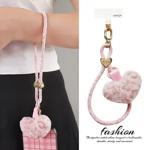 Mobile phone lanyard with heart-shaped plush accessory, women's wrist strap, short length, autumn and winter new product, portable for outdoor activities, travel, and outings, Cellphone