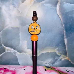Pumpkin Pen with Fun Face Design and Vibrant Orange Tip Perfect for Halloween Themed Stationery
