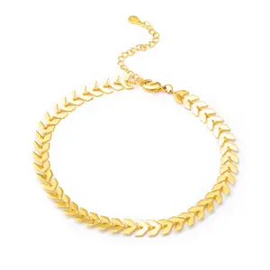 A 925 sterling silver chain anklet with gold plating, featuring wheat arrow-shaped beads and a bell, with an adjustable design.