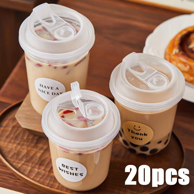 Stack of 15oz clear PET cups with lids
