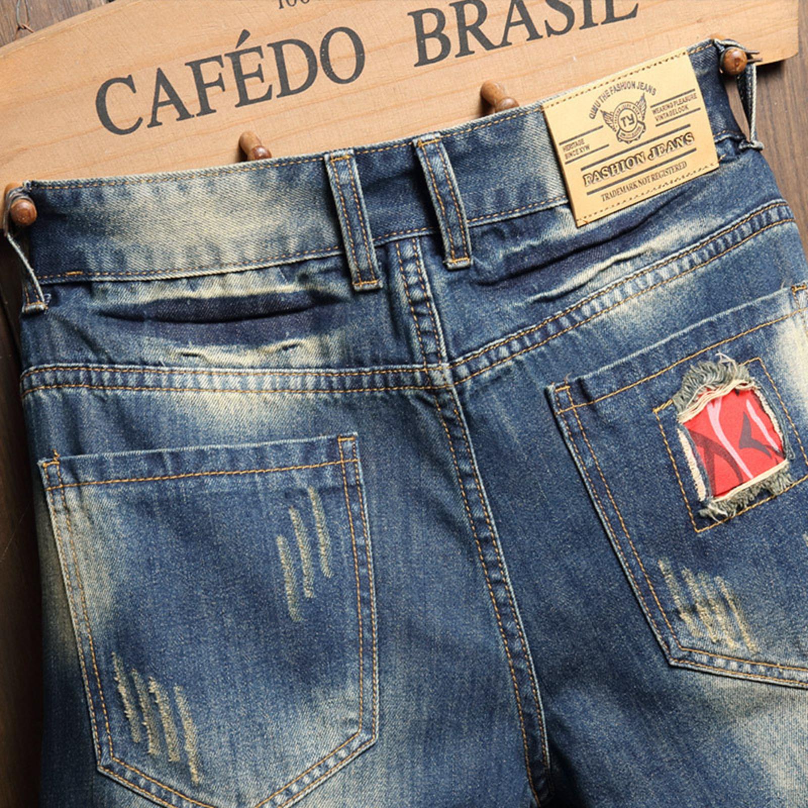 Bleached distressed denim mid-rise shorts with no stretch, multiple rips, raw hem, red-edge print lining—trendy five-inch inseam