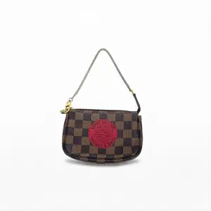 Pre-owned Louis Vuitton Coated canvas with leather trim Crossbody Bags Pochette Accessoires Brown Damier Ebene with red Game On motif Good S012260225137