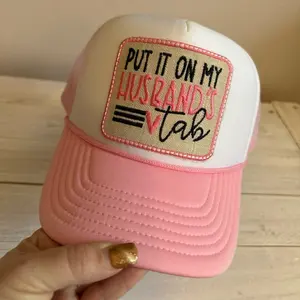 Put It On My Husband’s Tab Foam Front Trucker Hat - Pink & White Mesh Cap with Embroidered Patch