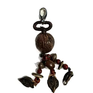 Bag Charm made out of dry seeds with intricate beadwork and natural seed accents