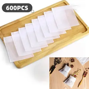 600 tea filter bags and 1 tea spoon, empty tea bags, disposable bags for filtering bulk tea, coffee, spices, and herbs, tea spoon (3.54 x 2.75 inches), hand tools set.