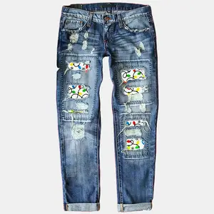 Women’s Christmas holiday ripped mid-rise straight-leg denim jeans pants with colorful light print and festive design, fitted blue style
