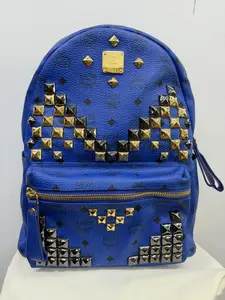 Pre-owned MCM Large Stark Backpack in Blue Visetos Coated Canvas with Studded Embellishments and Gold Tone Hardware