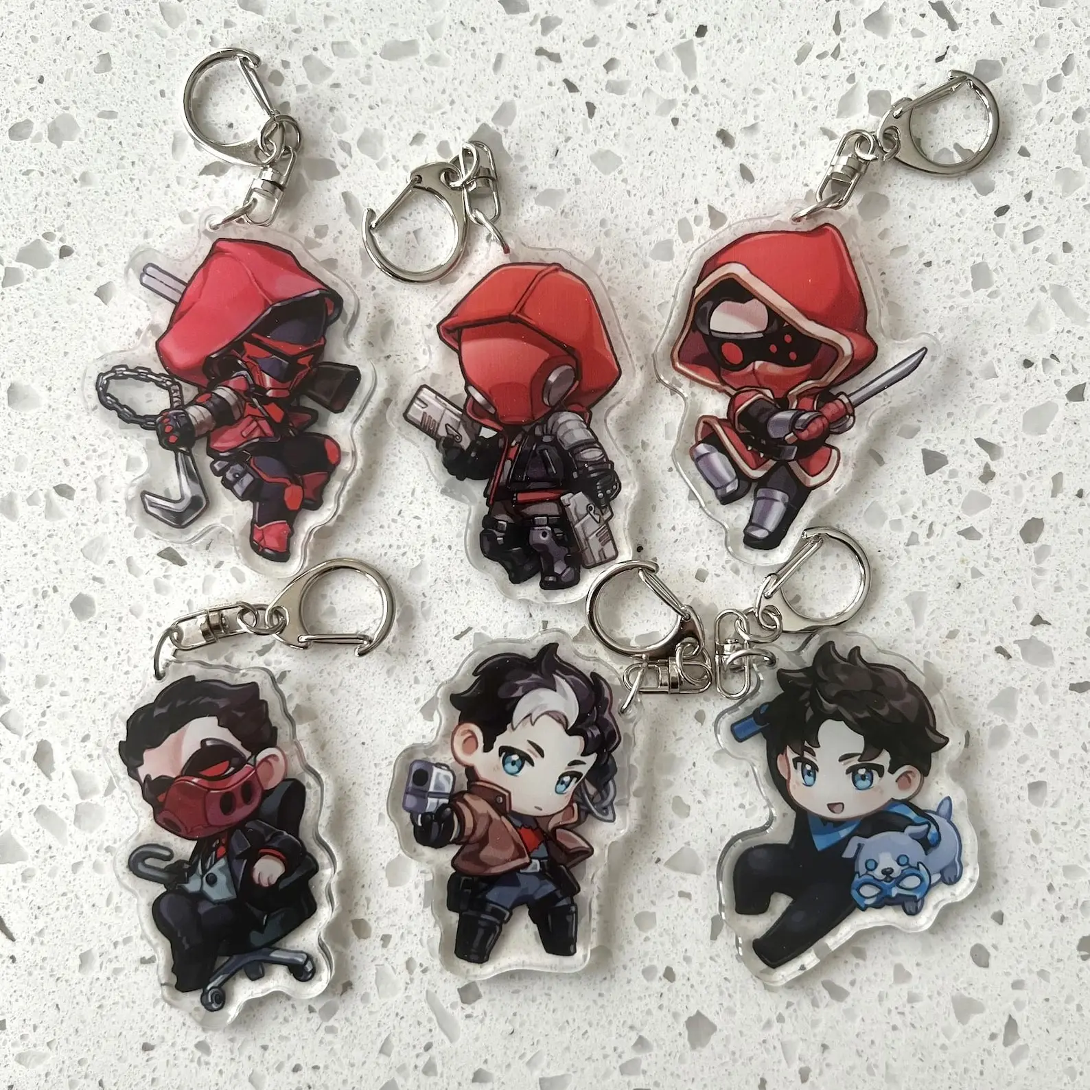 Red Hood And Nightwing Keychain In Cool Chibi Style, Cute Acrylic Keychain, Durable, And Perfect For Bags, Keys, Or Gifts. Great For Daily Use Or As Thoughtful Little Gifts For Your Friends And Yourself.