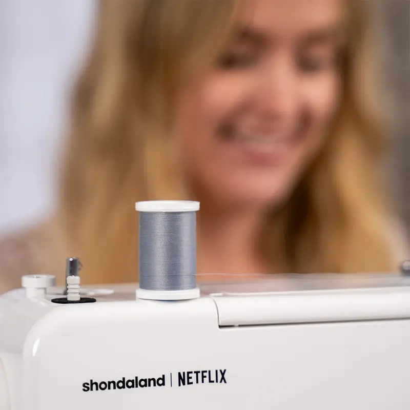 Thread spool and licensed design markings on the sewing machine