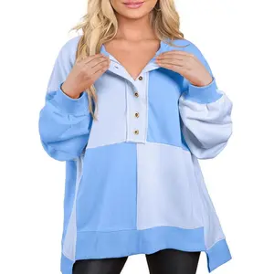 A women's loose long-sleeved hooded sweatshirt with patchwork color-blocking and buttoned lapels, casual, fashionable and versatile.