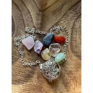 Silver round Tree of Life locket with 7 interchangeable crystals on 16+ inch silver plated chain